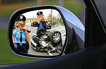Car accident scene with police figurines in side mirror