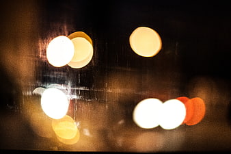Abstract Bokeh Lights on Rainy Night Window