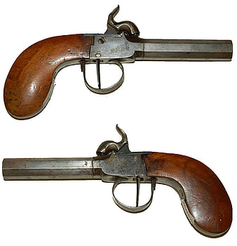 Antique flintlock dueling pistols on white background