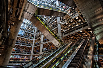 Low angle view of escalators in modern office atrium
