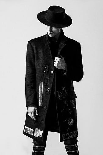 Man in Black Fedora and Decorated Coat