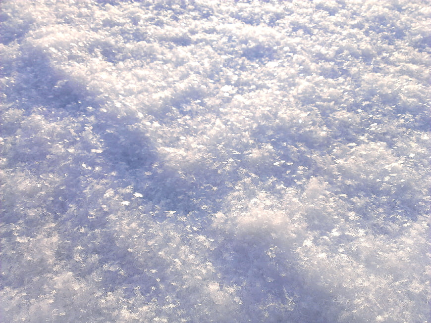 Close-Up Winter Snow Texture With Blue Shadows