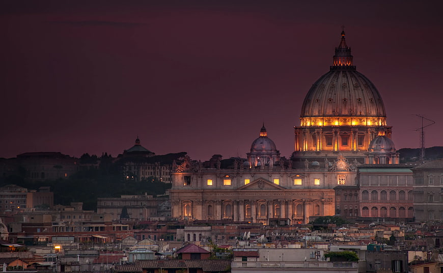 St. Peter's Basilica Illuminated at Dusk in Rome