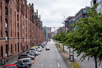 Urban Street View with Historic Brick Warehouses and Modern Buildings