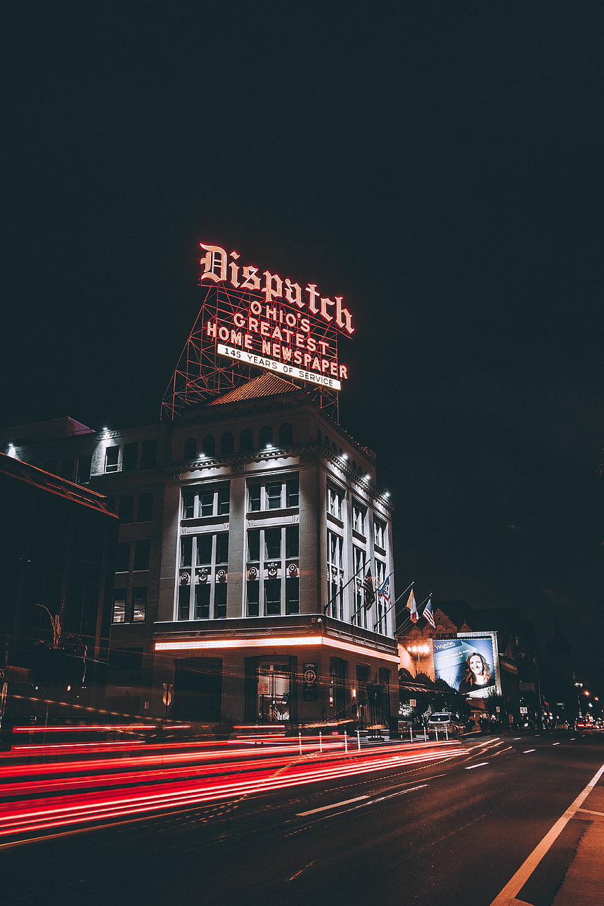 Night long exposure of Cincinnati Dispatch building with light trails