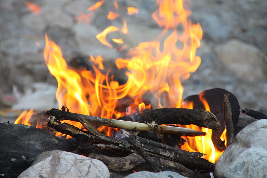 Close-up of burning campfire flames and wood logs