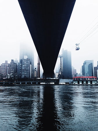 Under Manhattan Bridge View of East River and City Skyline