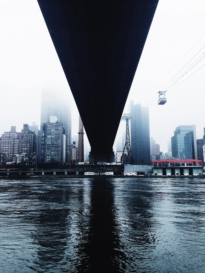 Under Manhattan Bridge View of East River and City Skyline