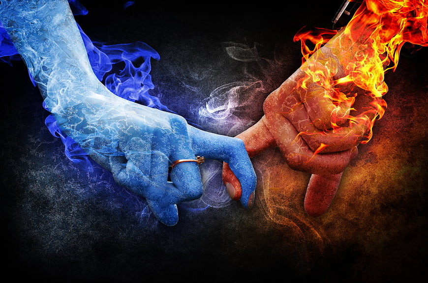 Conceptual Hands Holding Together With Fire And Ice Effects