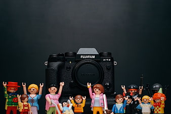 Fujifilm Camera Surrounded by Colorful Toy Figures