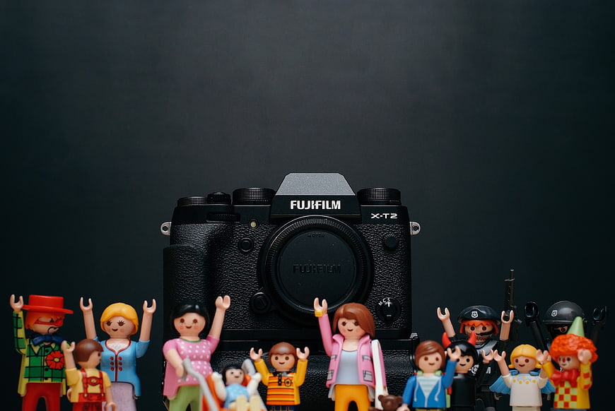 Fujifilm Camera Surrounded by Colorful Toy Figures