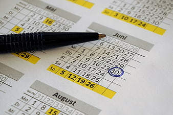Black pen pointing to circled date on German calendar