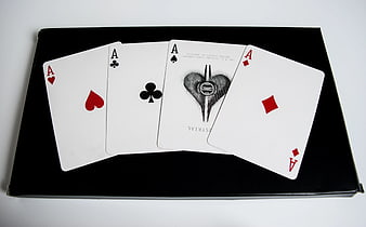 Four Aces Playing Cards on Black Box