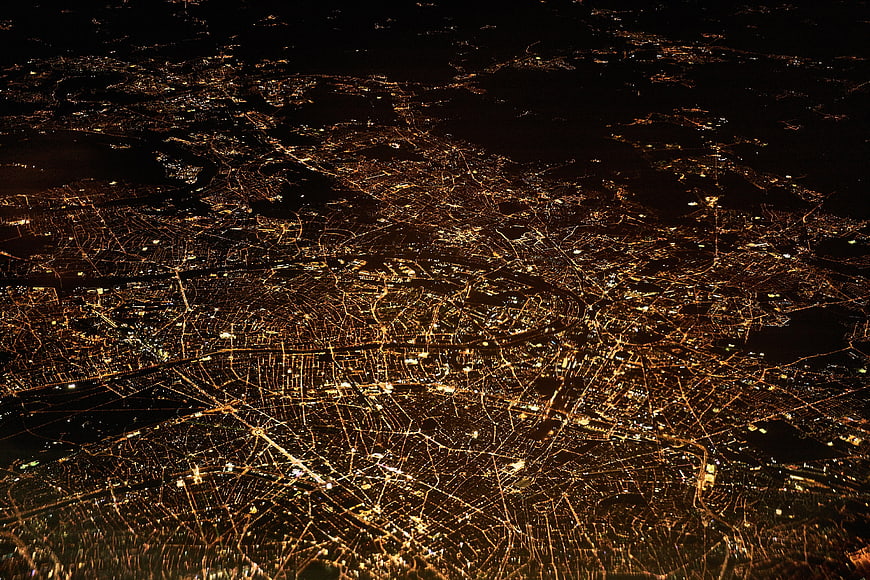 Aerial Night View of City Lights and Urban Grid