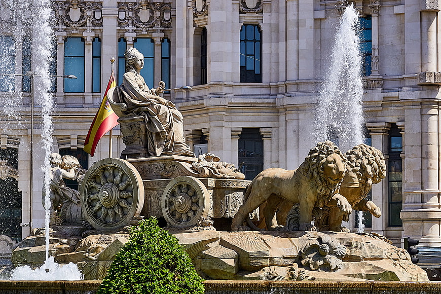 Fountain of Cybele with Lions and Spanish Flag in Madrid