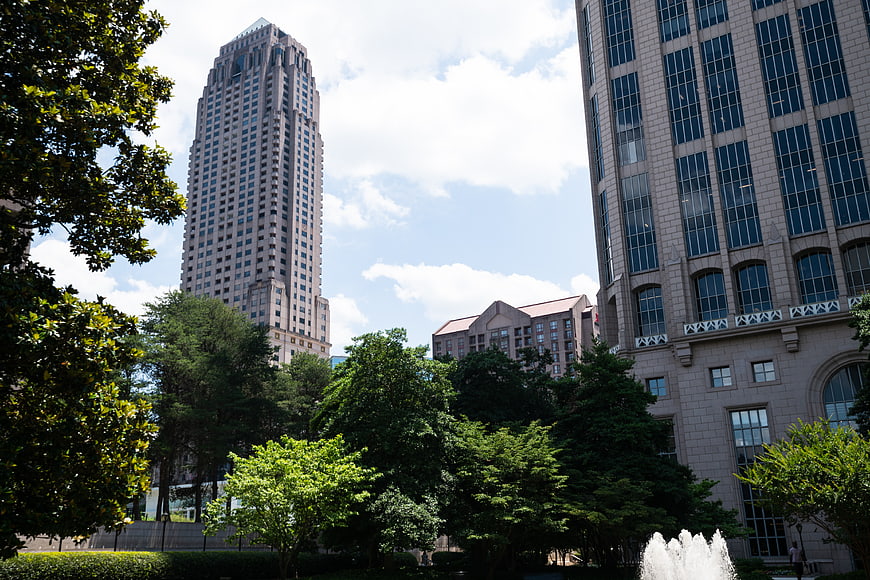 Urban Skyscrapers and Green Park with Fountain