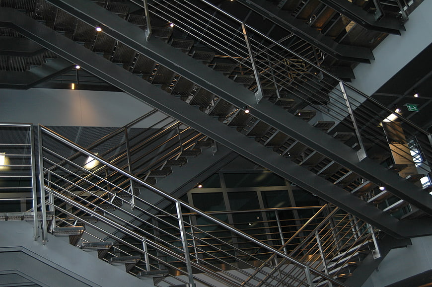 Modern industrial metal staircase with steel railings