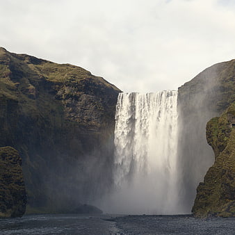 Majestic Skógafoss Waterfall in Iceland with Mossy Cliffs