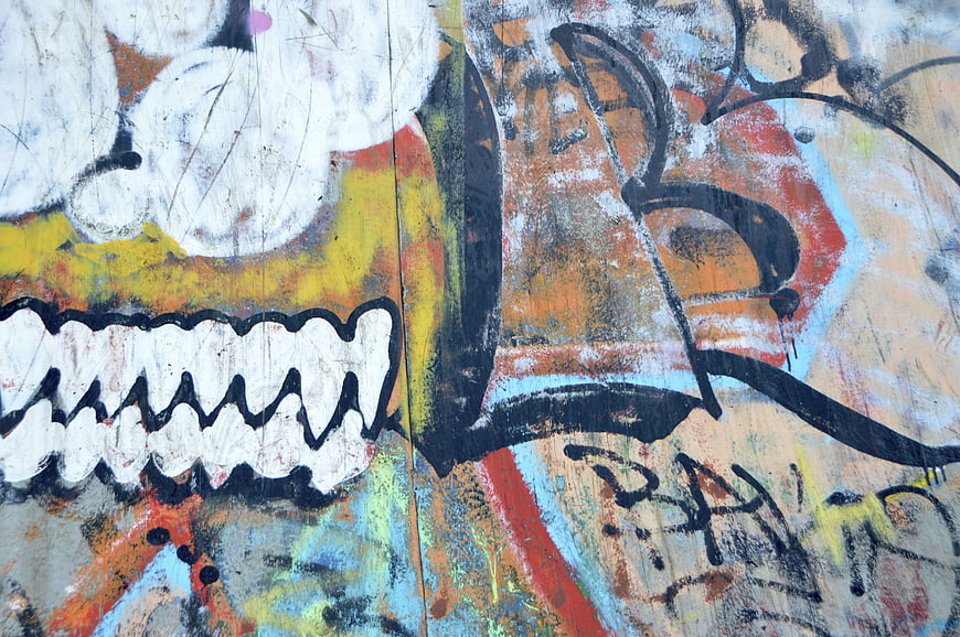 Colorful graffiti art on weathered concrete wall