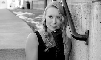 Black and white portrait of stylish woman in gloves