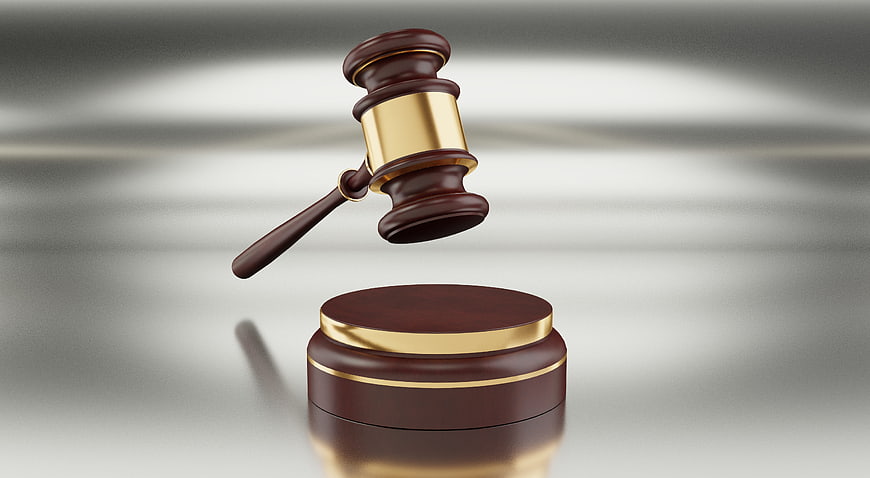 3D Rendered Wooden Gavel And Sound Block With Gold Accents