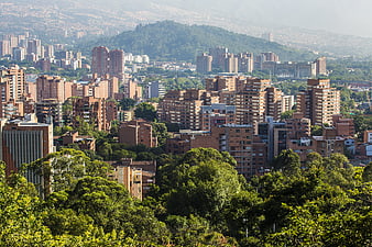 Medellin Cityscape With Lush Green Hills And Urban High-Rises