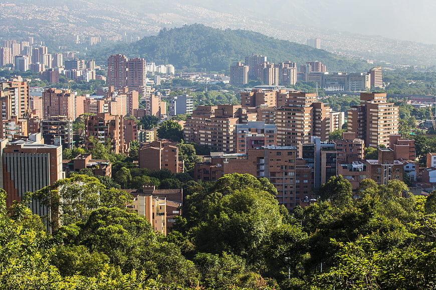 Medellin Cityscape With Lush Green Hills And Urban High-Rises