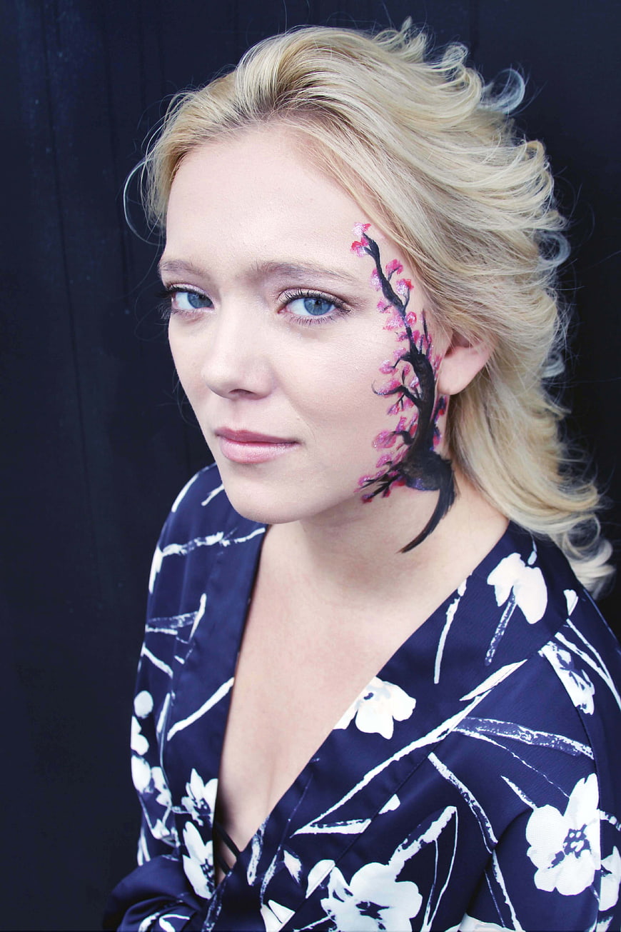 Blonde Woman with Artistic Cherry Blossom Face Paint
