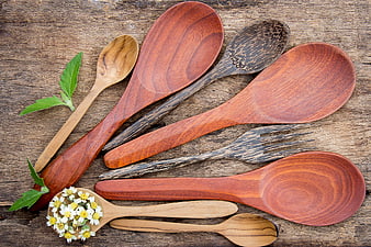 Assorted Wooden Spoons and Forks on Rustic Table