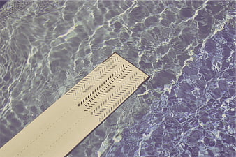 Top View of Diving Board in Swimming Pool Water