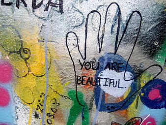 Handprint Graffiti With You Are Beautiful Message On Textured Wall