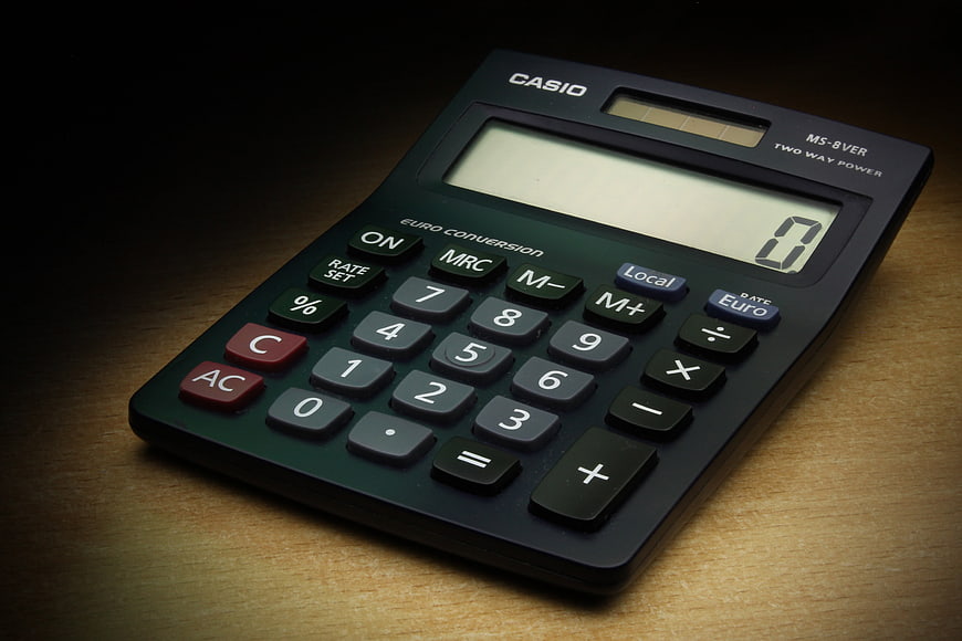 Casio MS-8VER Desktop Calculator On Wooden Desk