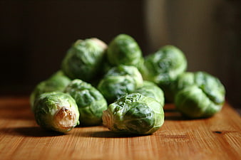 Fresh Brussels Sprouts on Wooden Cutting Board