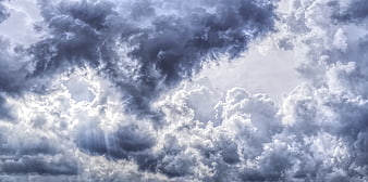Dramatic Storm Clouds with Sunbeams Breaking Through