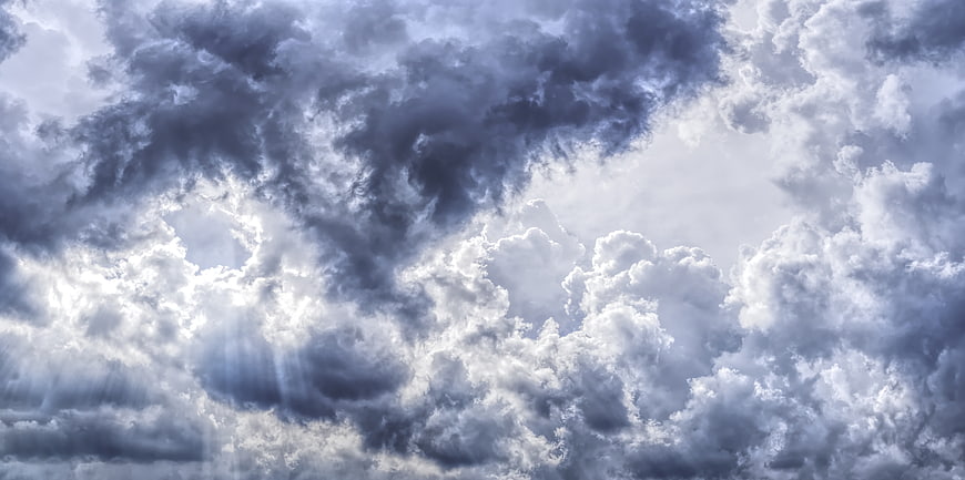 Dramatic Storm Clouds with Sunbeams Breaking Through