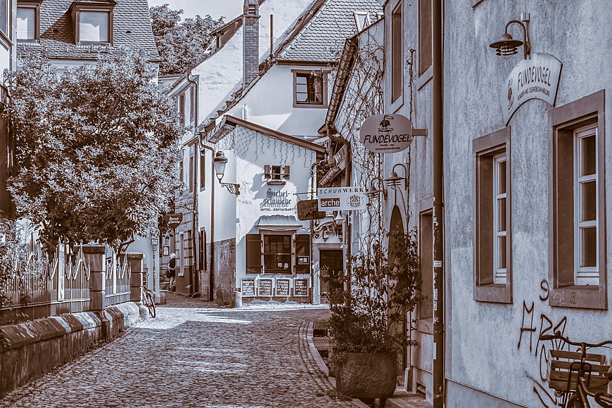 Historic Cobblestone Street in Freiburg with Traditional European Architecture
