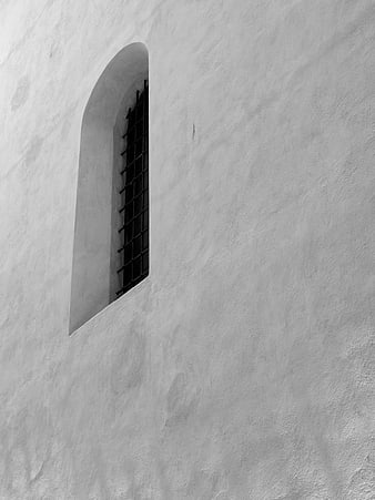 Minimalist Black and White Arched Window on Textured Wall