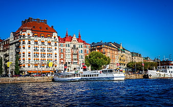 Stockholm waterfront architecture with boats and blue sky