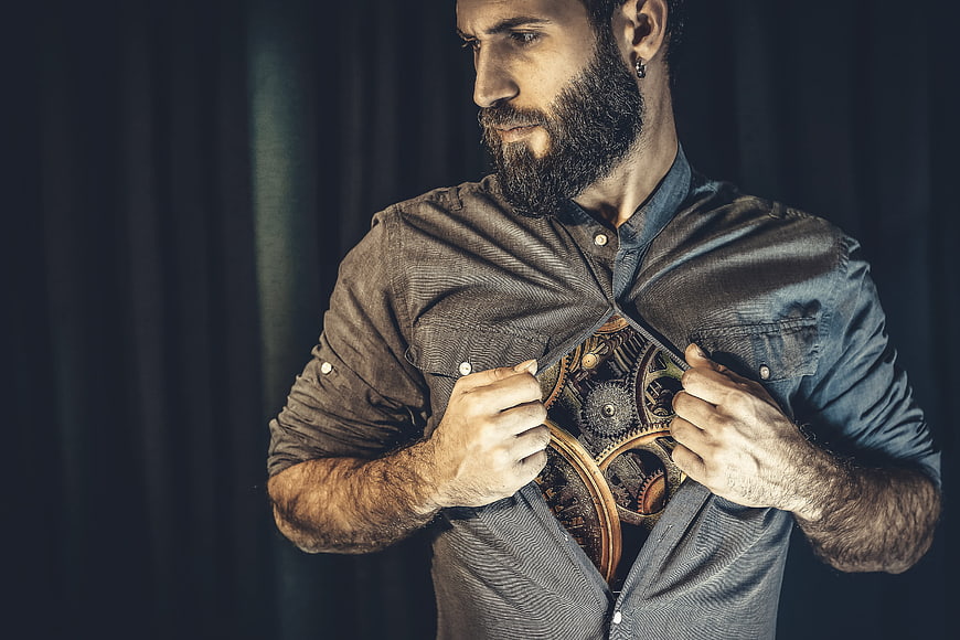 Bearded Man Opening Shirt To Reveal Mechanical Gears