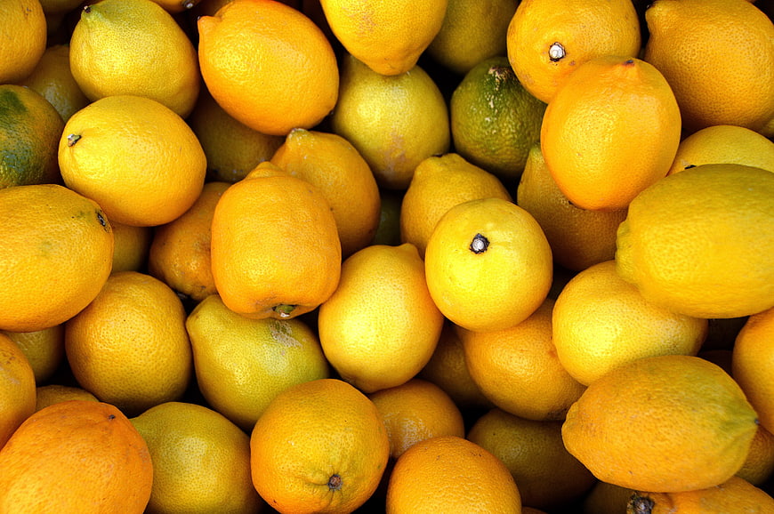 Close-up of fresh yellow lemons and citrus fruits