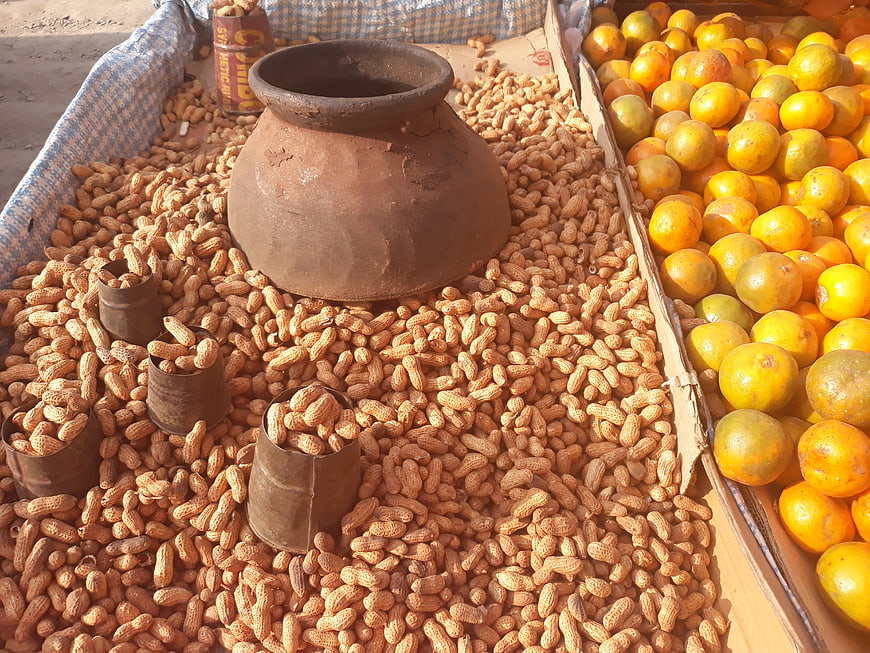 Peanuts and Oranges at a Local Market Stall