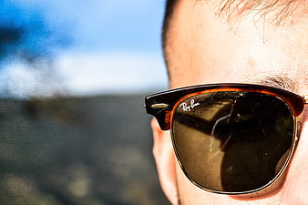 Close-up of Man Wearing Ray-Ban Sunglasses Outdoors