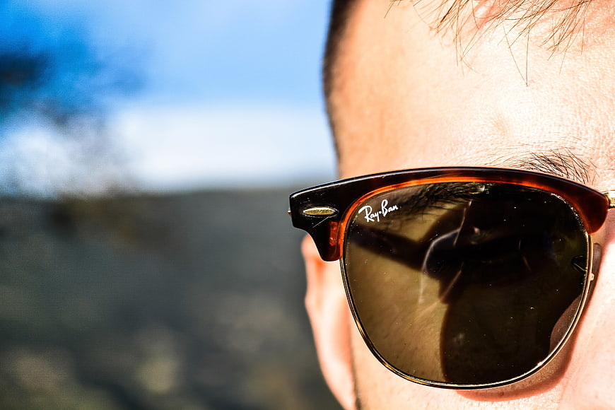 Close-up of Man Wearing Ray-Ban Sunglasses Outdoors