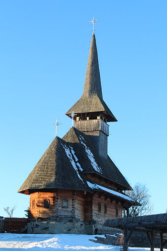 Traditional Wooden Church in Winter Snow Landscape