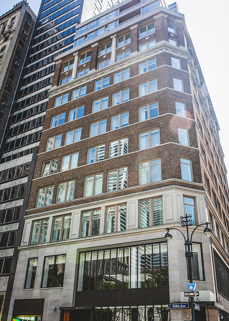 Low angle view of classic brick building on Fifth Avenue corner