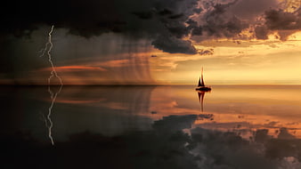 Dramatic Sunset Sailboat with Lightning Storm Reflection