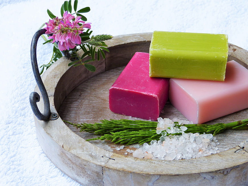 Handmade Natural Soap Bars on Wooden Tray with Herbs
