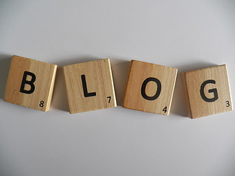 Scrabble Tiles Spelling Blog on Gray Background
