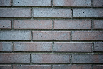 Close-up texture of weathered red brick wall pattern
