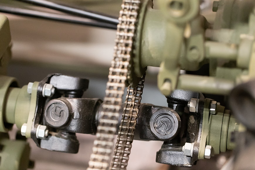 Close-up of industrial machinery chain and gears